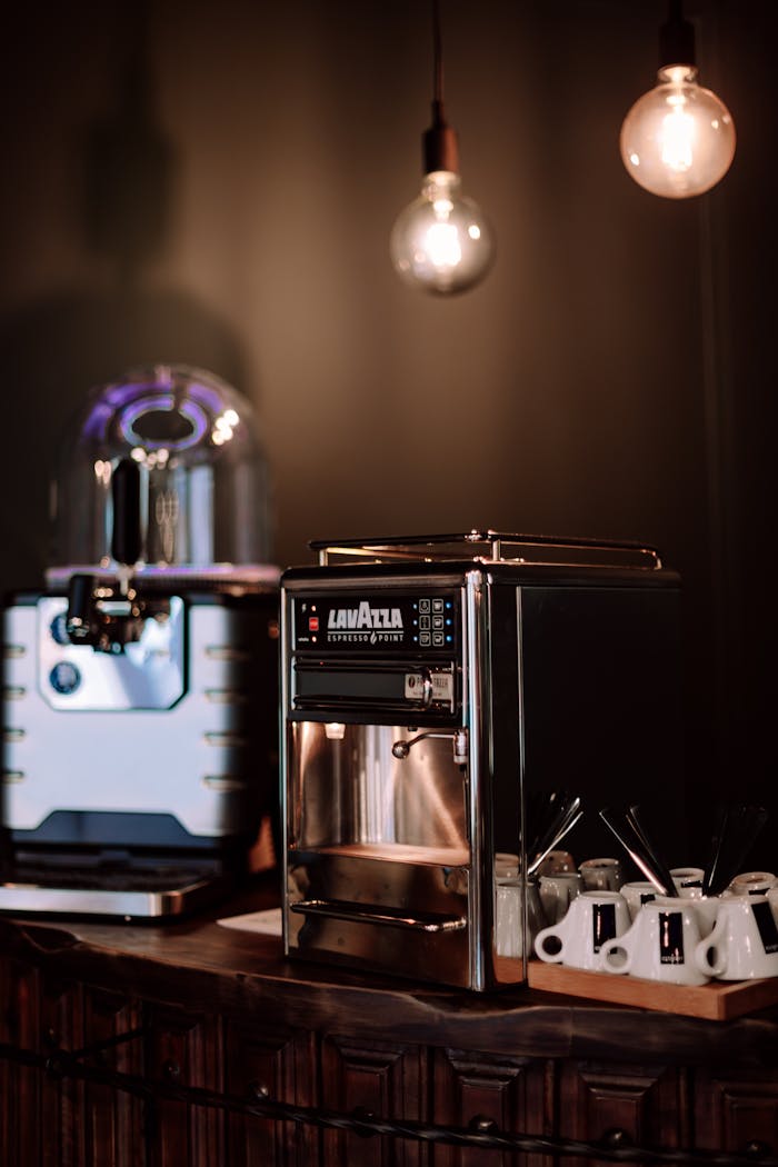 Stylish espresso machine and coffee setup in a chic Geneva café interior.