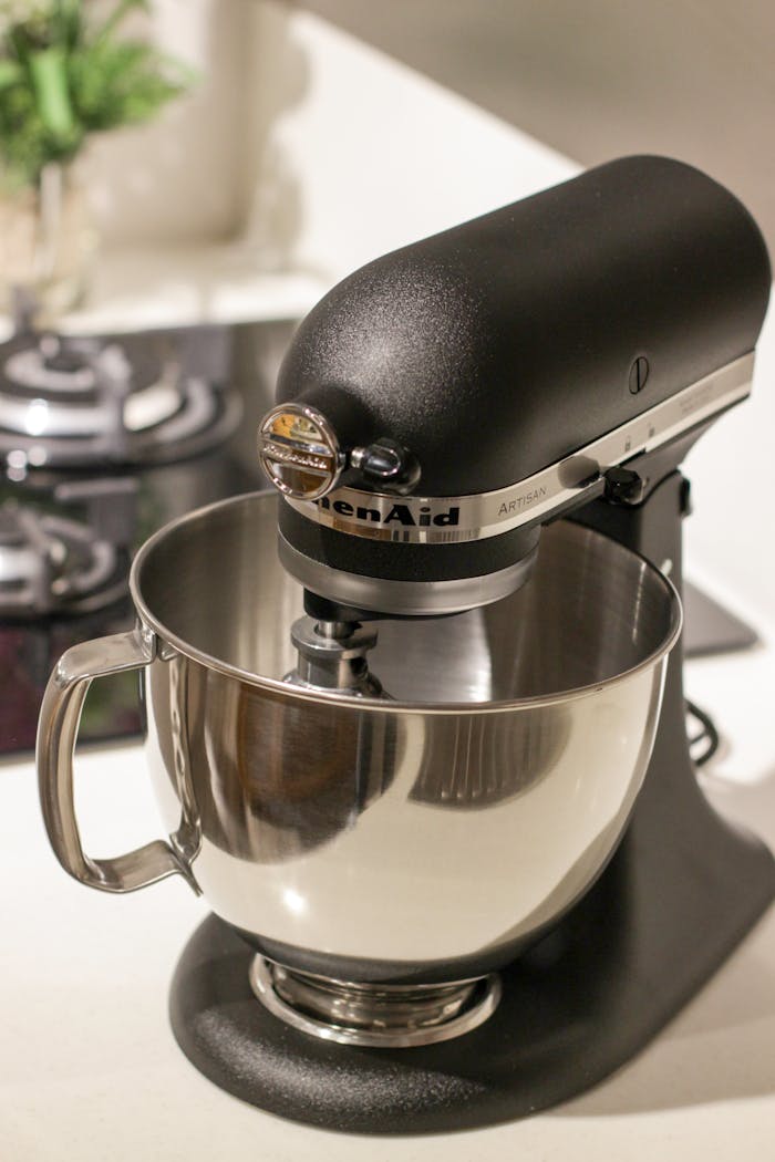services-img A stylish black kitchen mixer in a modern kitchen setting, perfect for baking needs.