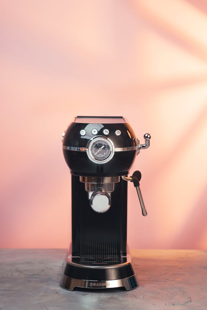 gallery-1 Sleek espresso machine against a warm background, perfect for home cafes.